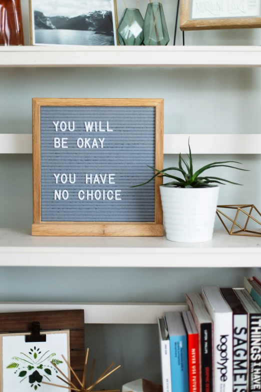 a sign in a display on shelves that says you will be okay