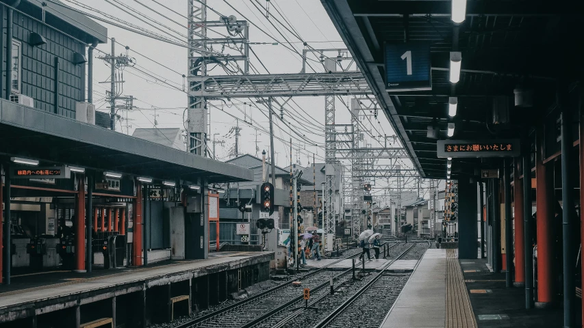 this is an empty train station with many railroad tracks