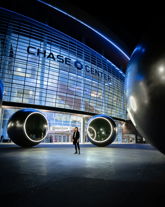 people are standing outside of a large building