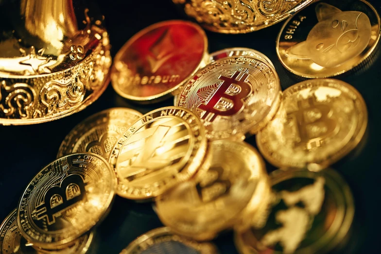 a collection of bitcoins and gold coins