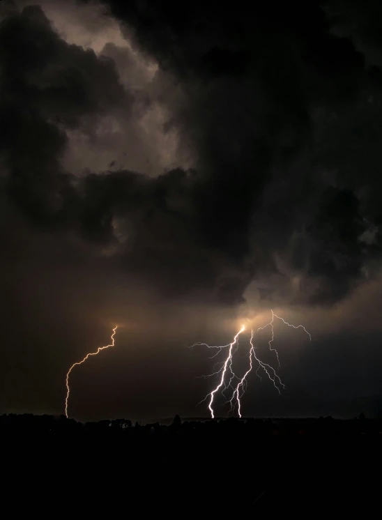 a huge cloud covered with lightning during the night