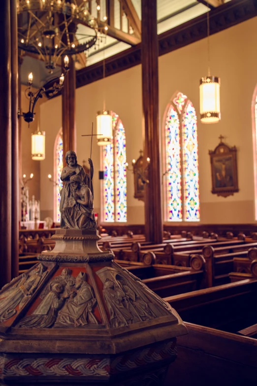 a church filled with wooden pews covered in glass windows