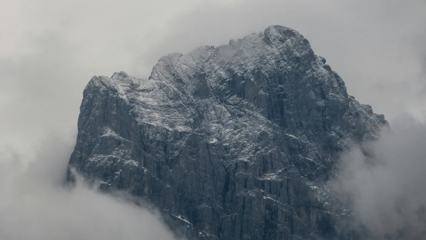 some mountains covered in snow in the daytime