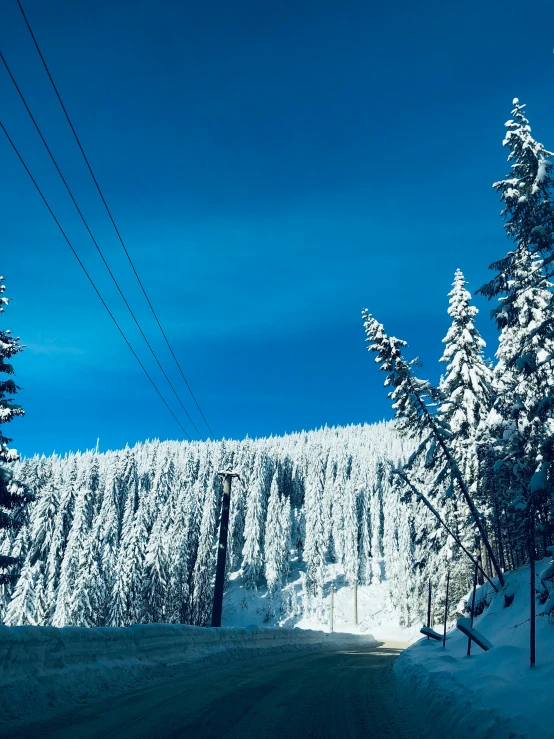 a person riding skis down a snow covered slope