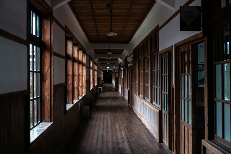 a long hallway with wooden slats lined along the side of it