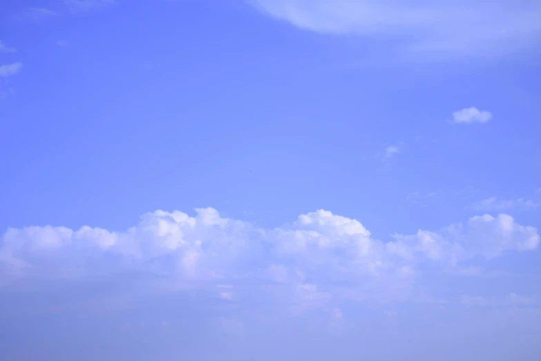 some people are on the beach flying a kite