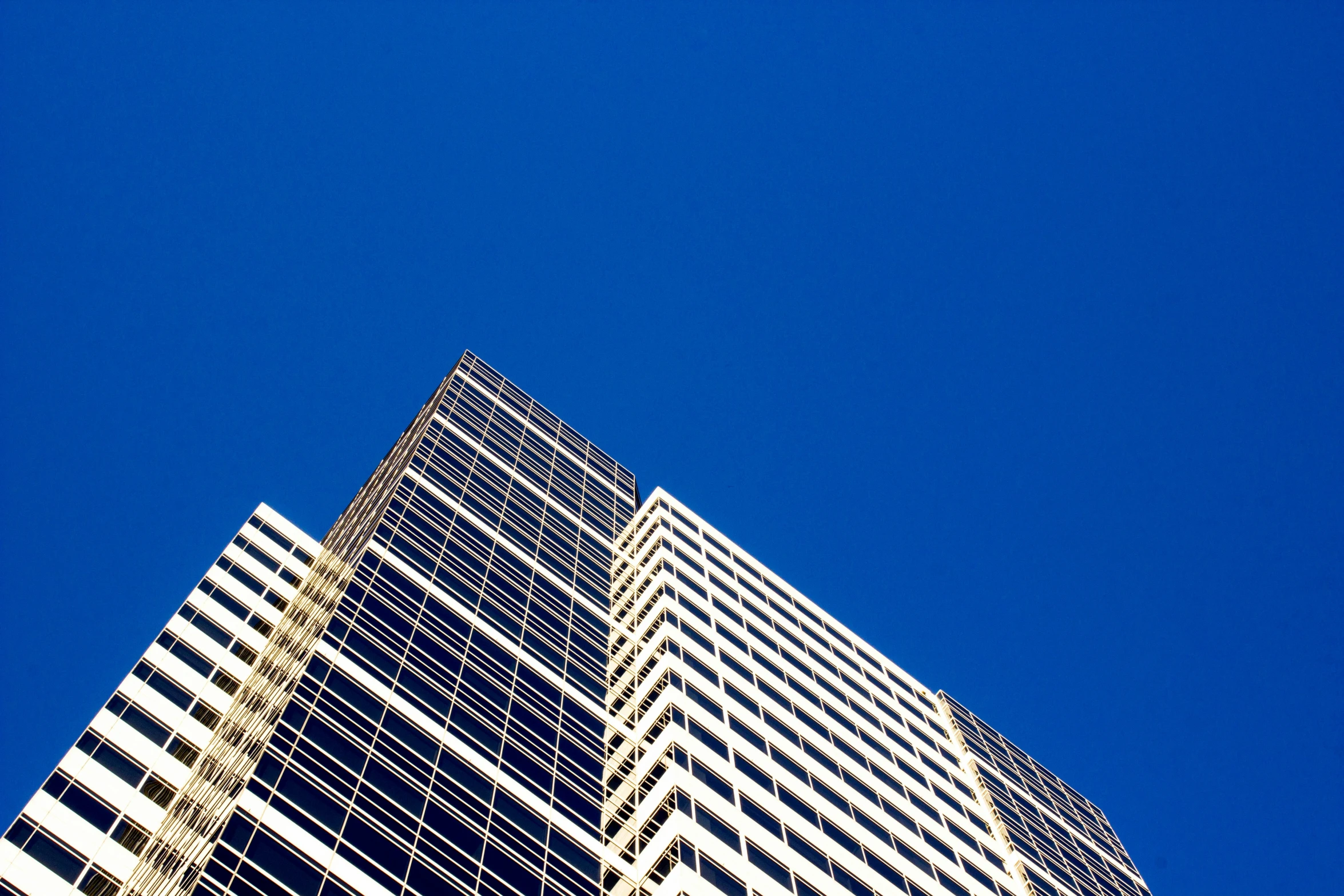 the top of a building against a blue sky