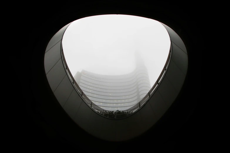 the view of a building looking out through an open window