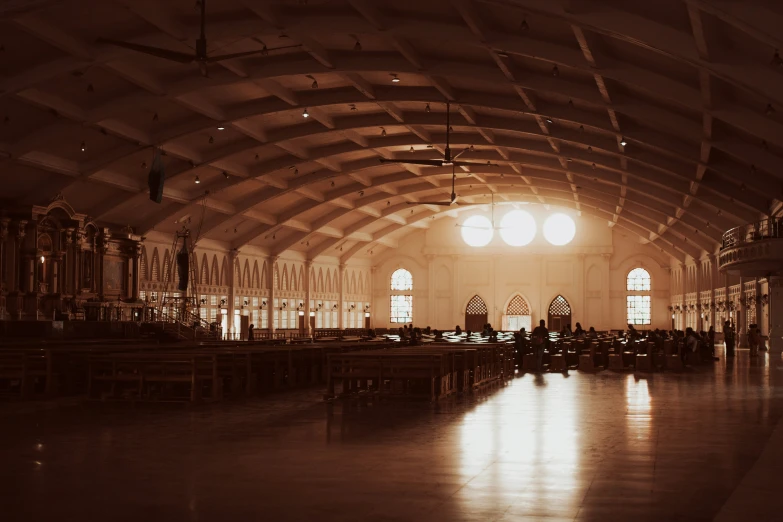 a large, ornate indoor church in a brown - toned po