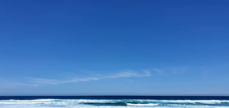 a beach that has waves crashing in to shore