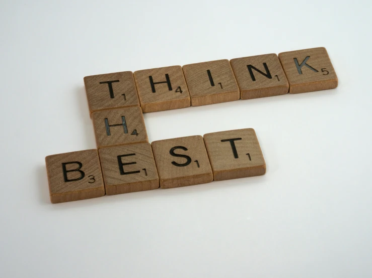 there are 3 scrabbles that say think, hug, think best