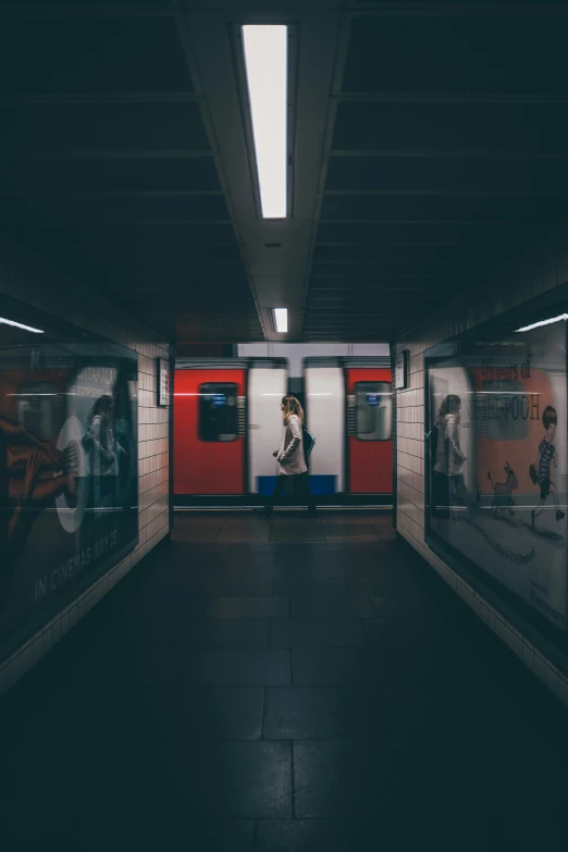 a subway station with two empty stalls on the side