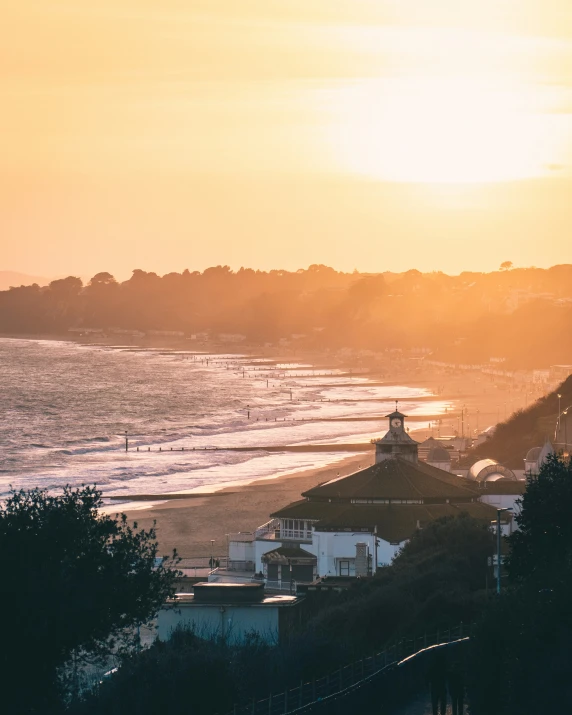 an overlook of a beach and waves on the shore