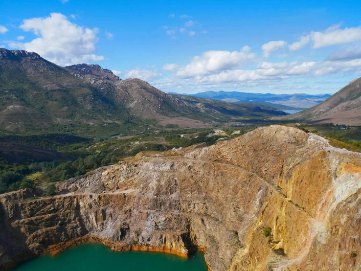 the mountains have cliffs and large lakes on them