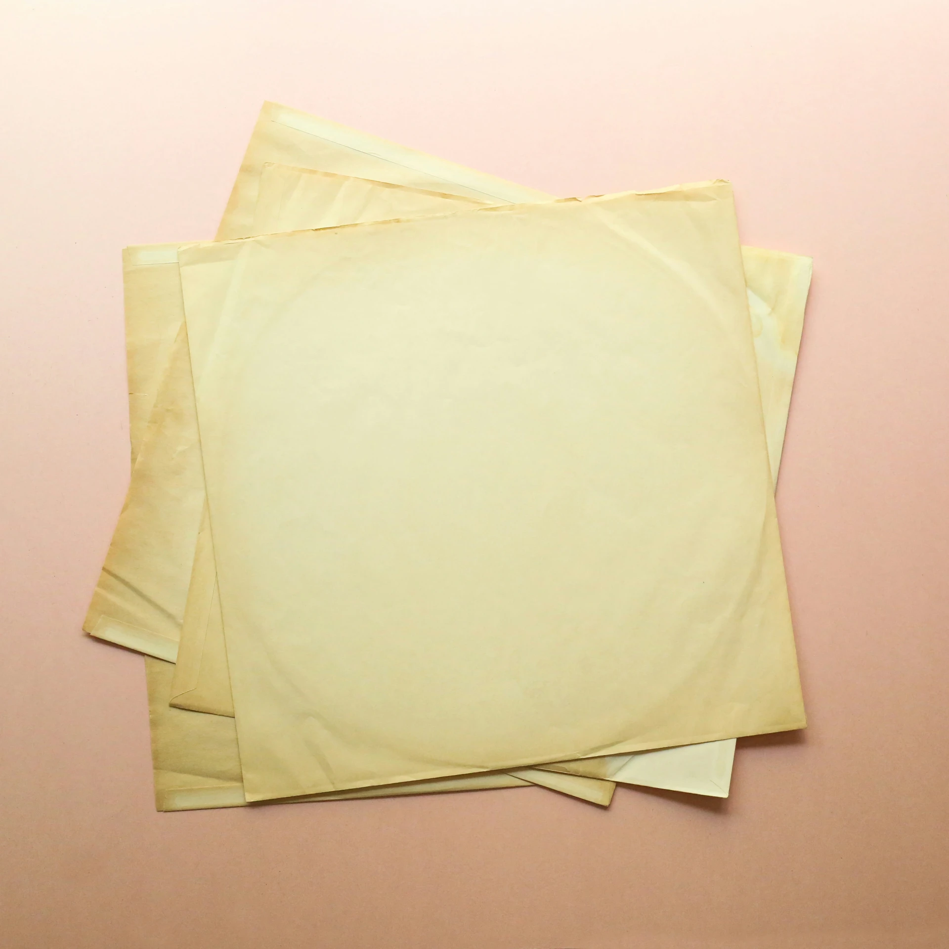 two sheets of parchment paper are next to each other