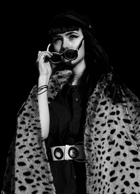 a woman is wearing a costume and holding binoculars