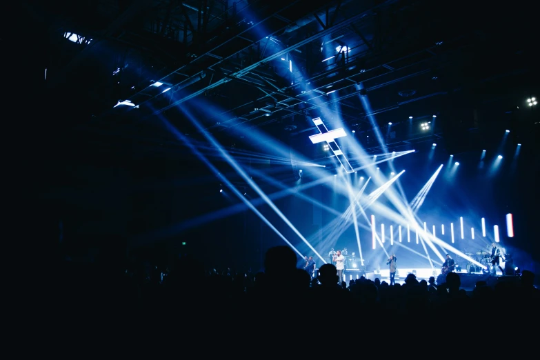 a group of people standing in front of a stage