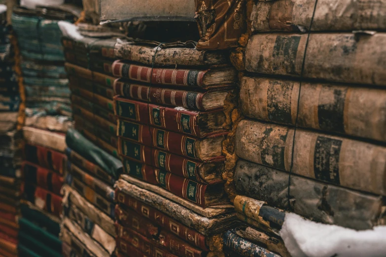 the large stacks of books are all piled on one another