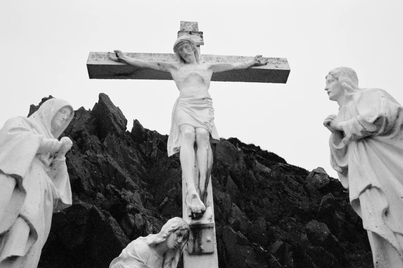 jesus statue on top of a mountain with statues