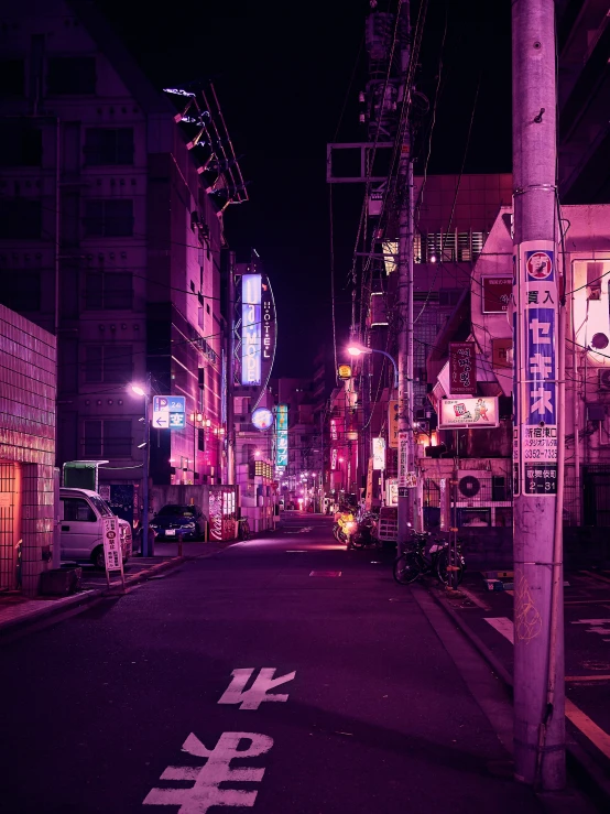 a street with signs on it in the middle of a city