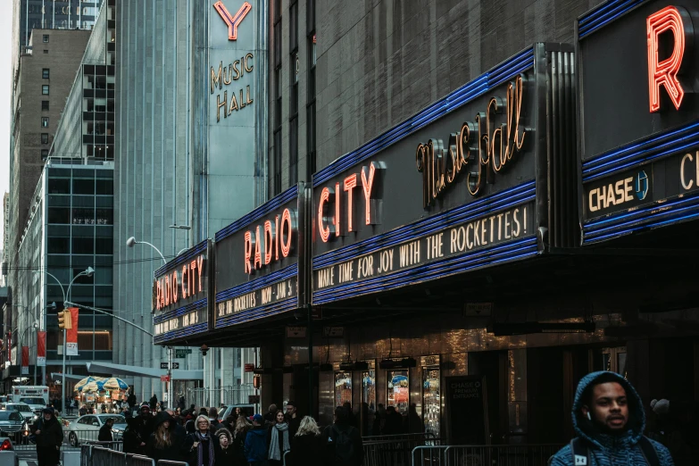 a couple walking down a crowded street in a city