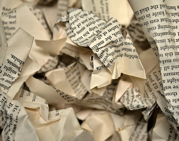 a pile of old book pages that have been folded and placed together