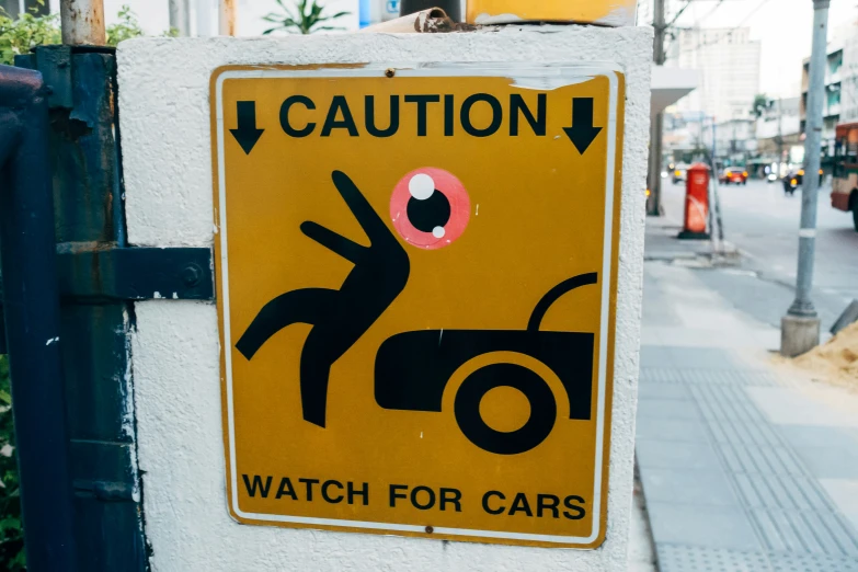 a caution sign that shows the time to watch for vehicles