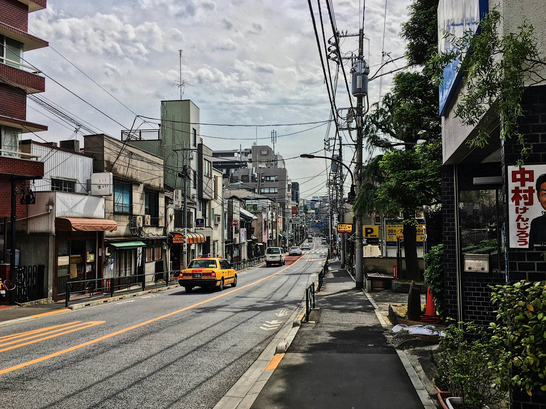 an urban street with traffic moving through the streets