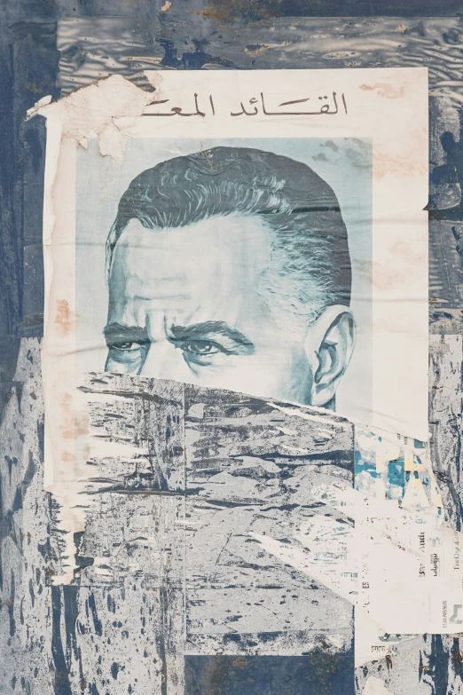 a cutout of a man's face against a wooden wall