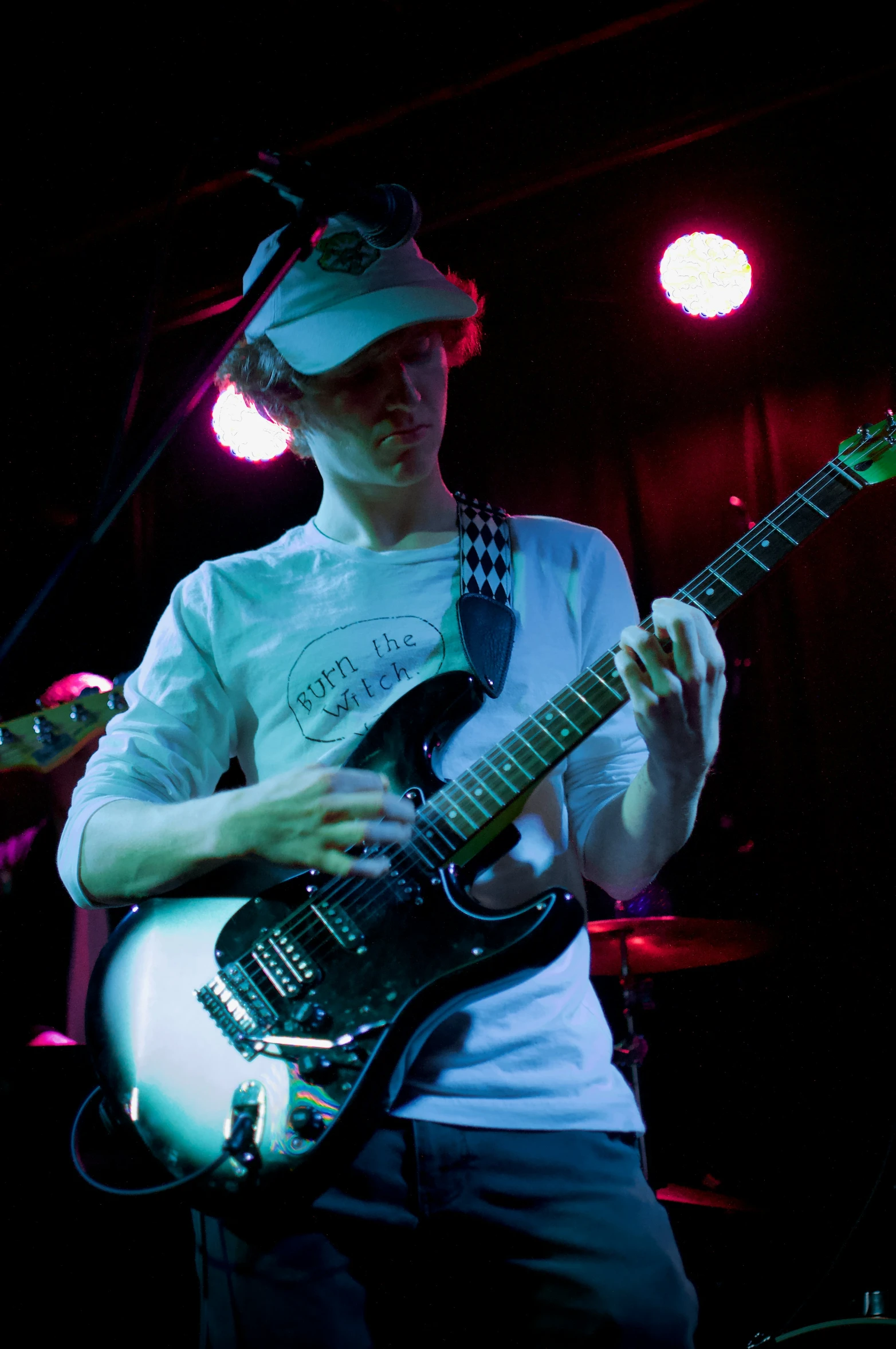 a person playing a guitar at a concert