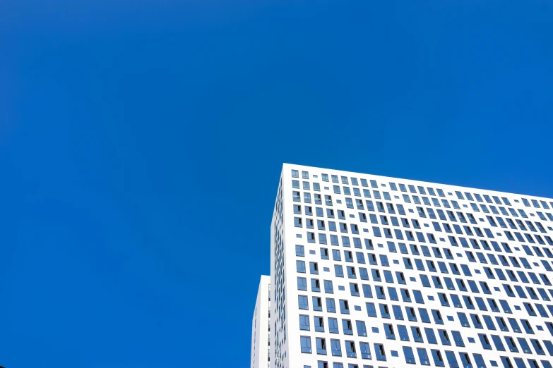 a building and a traffic sign stand tall