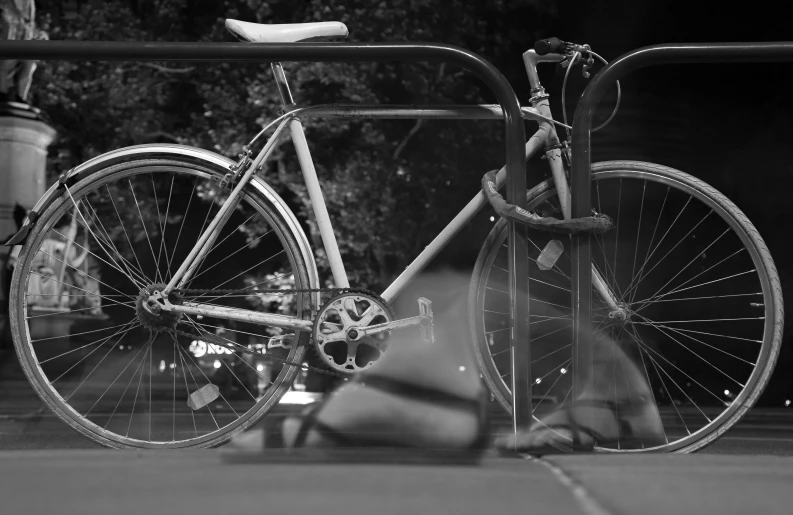 an old, rusty bicycle is locked up on the bike rack