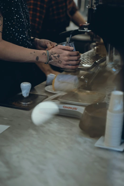 two hands that are on the counter