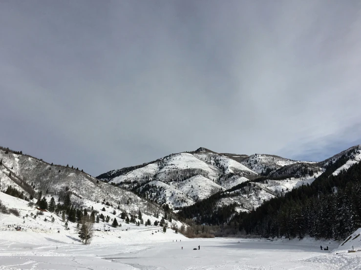 a group of mountains that has snow on them