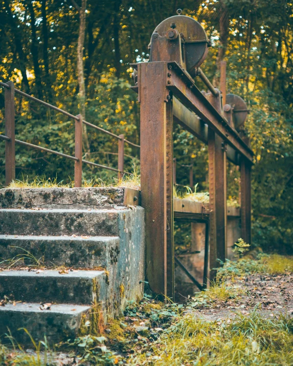 a close up of some steps near an iron gate