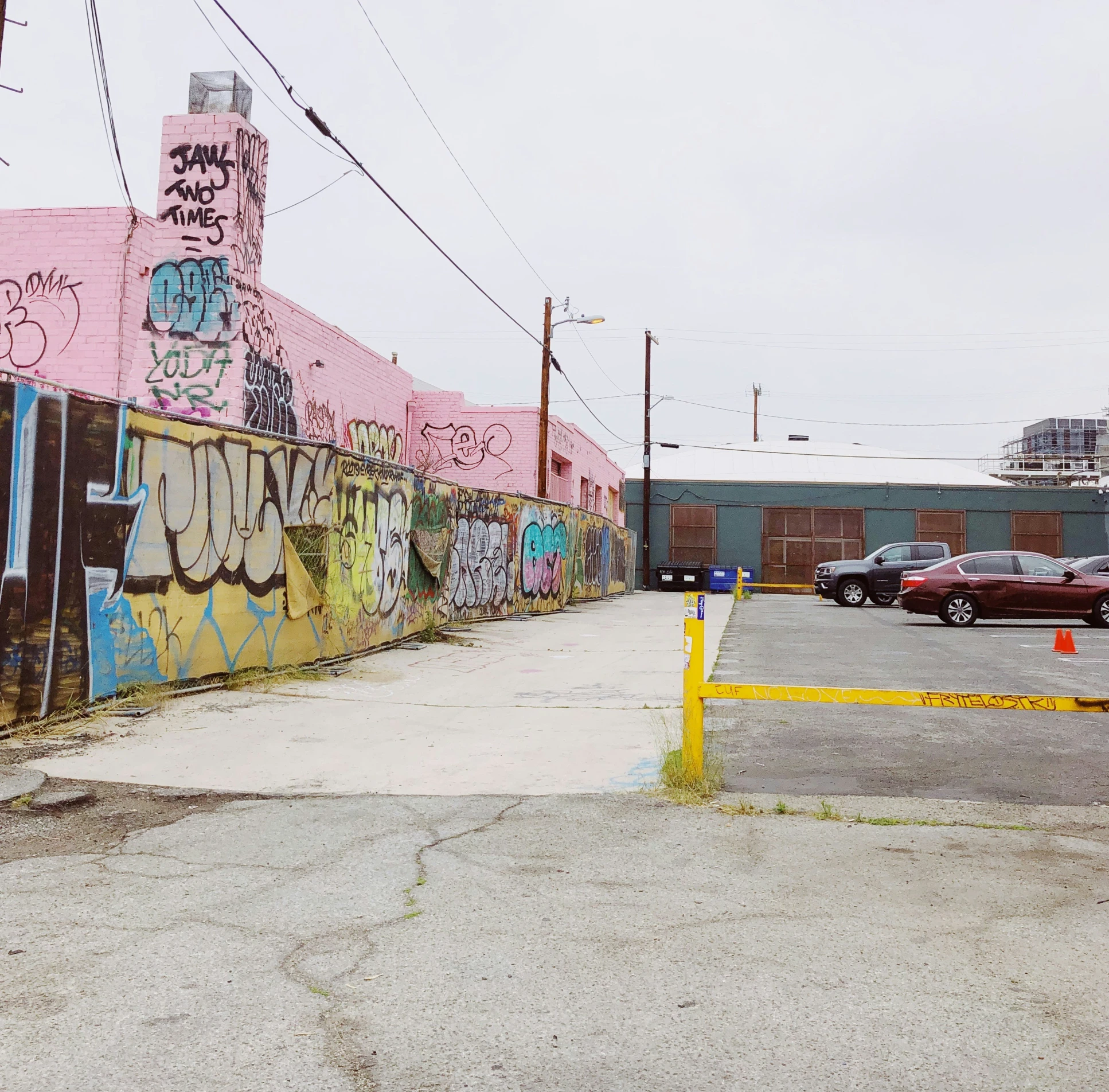 colorful graffiti painted on the side of building in a city