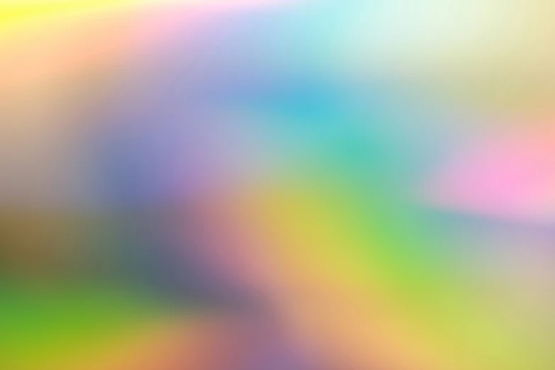 a blurred image of a green blue pink and yellow