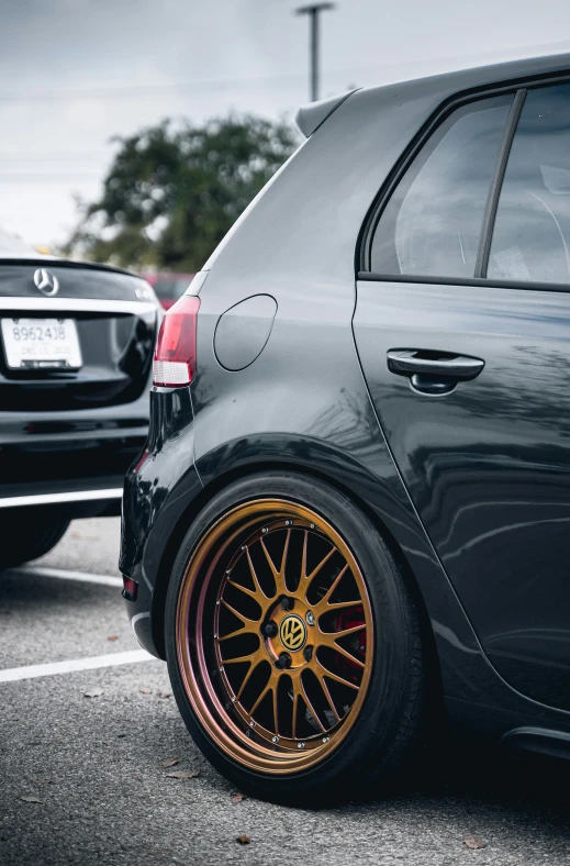 two parked cars on the side of the road