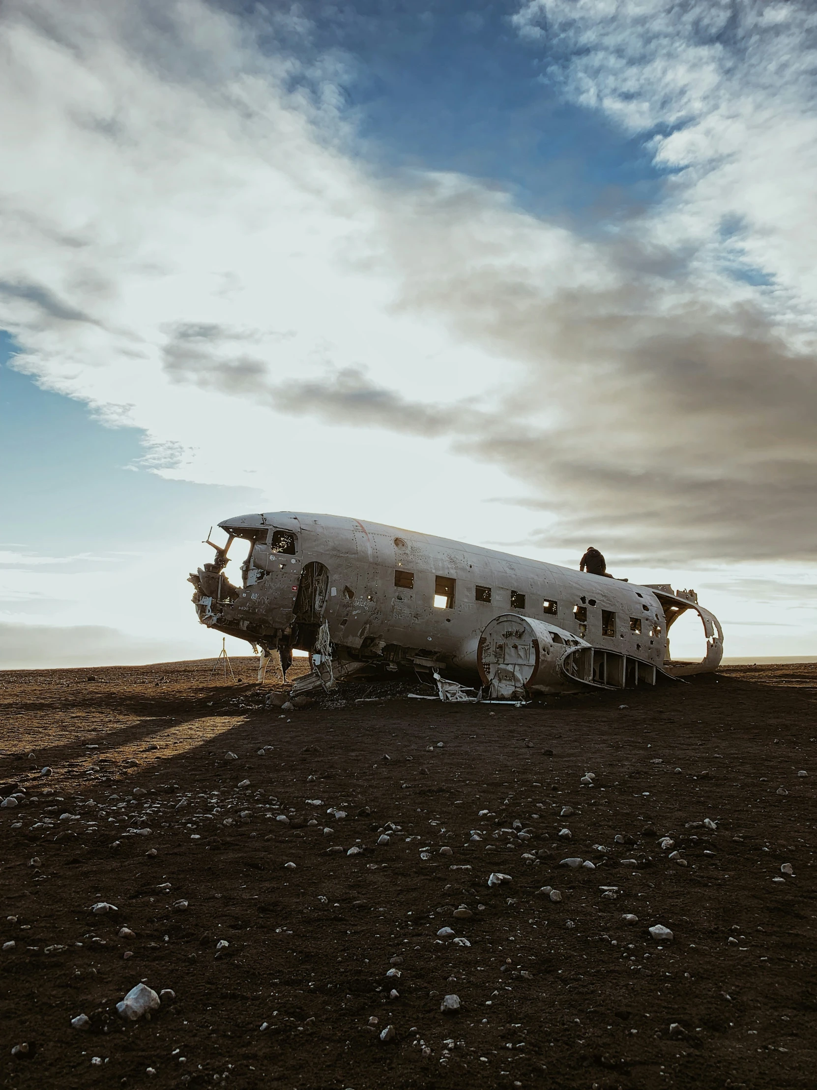 a old airplane sitting in the middle of nowhere