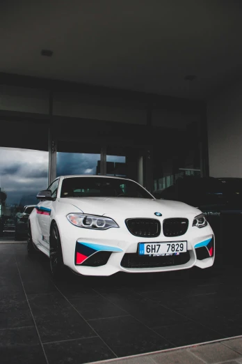 a bmw car parked in front of a building