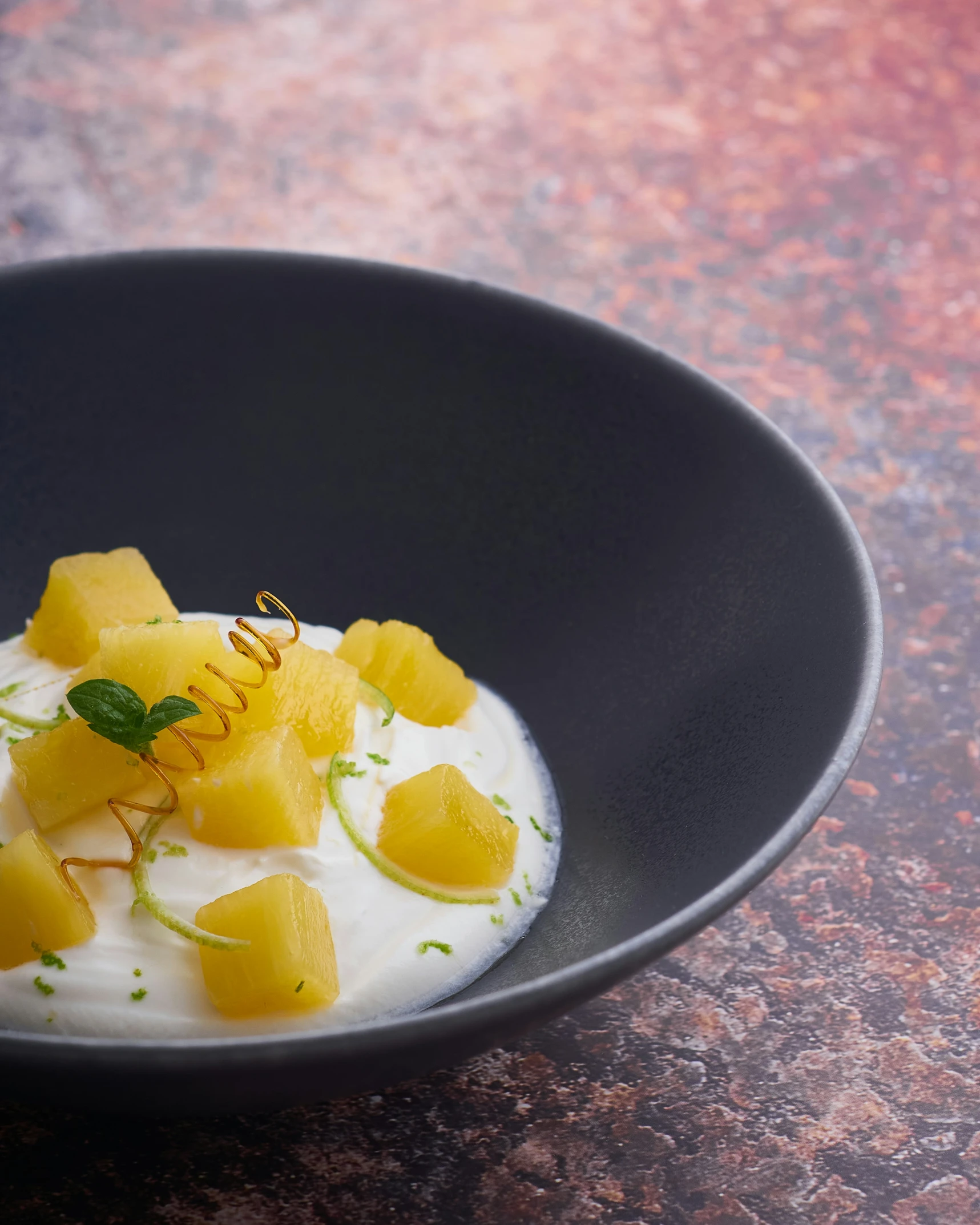 a food dish sitting on top of a black plate