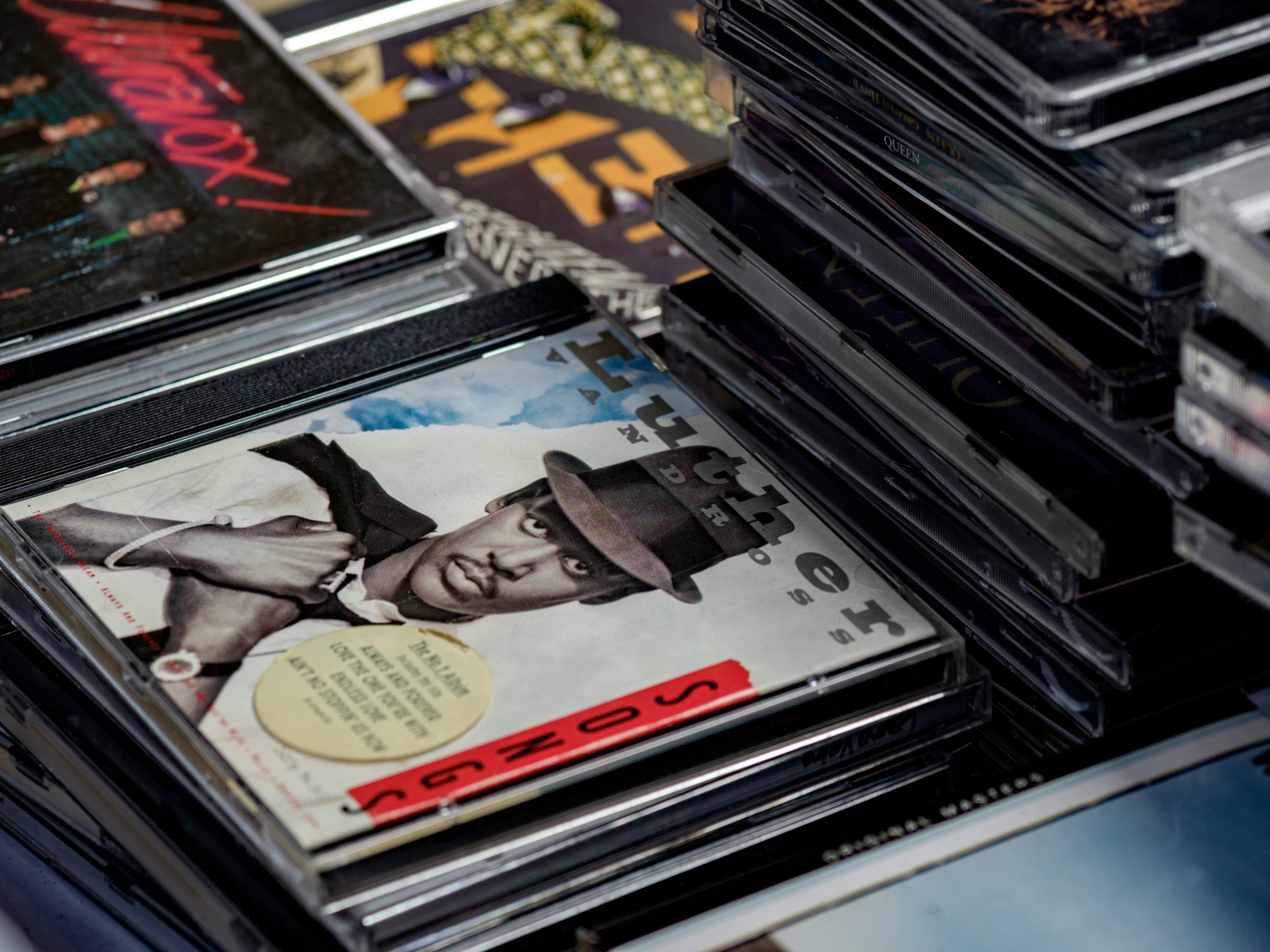 a collection of cds and cds are stacked up