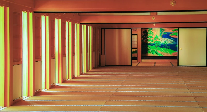 a hallway with multiple striped walls and an abstract painting