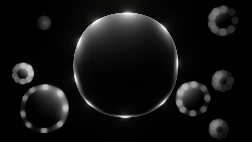 the surface is dark, blurry, and surrounded by bubbles