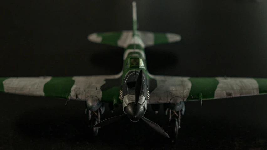 a plane with green stripes is seen here