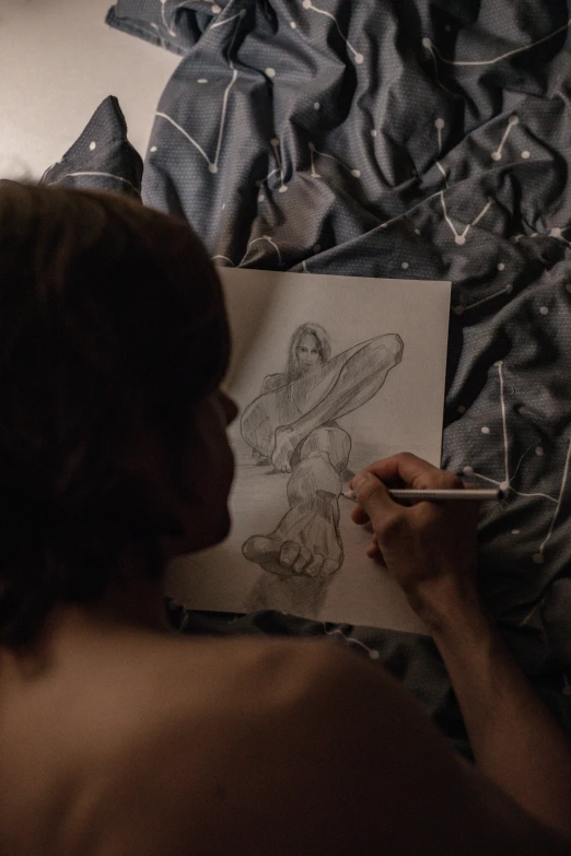 the woman is drawing a portrait of a child