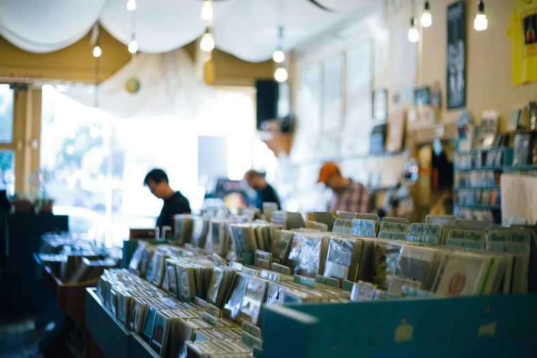 cd shelves and customers in a shop