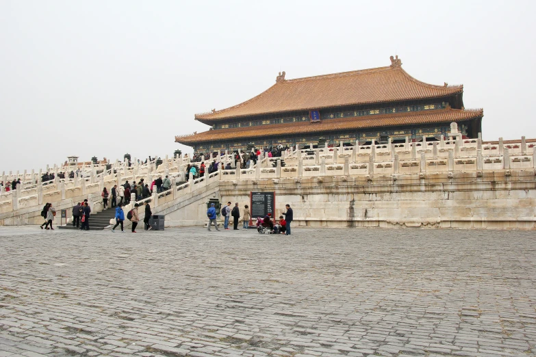 some people and buildings with a sky background