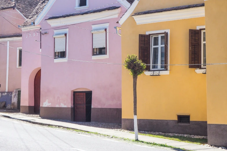 a bunch of colorful buildings on the street in an area