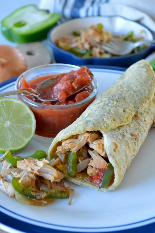 a plate with some tacos and a salsa